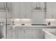 Stylish kitchen features stainless steel appliances, sleek countertops, and ample modern gray cabinetry at 8729 Marcana St, Las Vegas, NV 89166