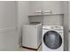 Well-equipped laundry room features modern Samsung washer and dryer units with storage at 8729 Marcana St, Las Vegas, NV 89166