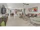 Open-concept living room showcasing contemporary decor and seamless flow to dining and kitchen at 8729 Marcana St, Las Vegas, NV 89166