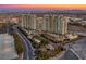 Aerial view of luxury high-rise buildings with lush landscaping and elegant entrance at 9103 Alta Dr # 1502, Las Vegas, NV 89145