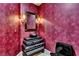 Powder room boasts venetian plaster, a custom vanity, and modern black fixtures at 9103 Alta Dr # 1502, Las Vegas, NV 89145