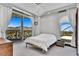 Bright bedroom with beautiful mountain views from the balcony, complemented by modern finishes and a stylish chandelier at 9103 Alta Dr # 1502, Las Vegas, NV 89145
