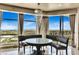 Cozy breakfast area with floor-to-ceiling windows offering panoramic city views and custom lighting at 9103 Alta Dr # 1502, Las Vegas, NV 89145