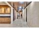 The hallway features a decorative wood ceiling, cabinet with granite counter, and marble flooring at 9103 Alta Dr # 1502, Las Vegas, NV 89145