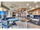 Gourmet kitchen featuring custom cabinets, a large island, and a luxurious chandelier over the breakfast table at 9103 Alta Dr # 1502, Las Vegas, NV 89145