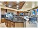 Spacious kitchen boasting black granite counters, custom cabinets, and stainless appliances at 9103 Alta Dr # 1502, Las Vegas, NV 89145