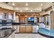 Open kitchen area with granite counters, stainless steel appliances, and additional seating area at 9103 Alta Dr # 1502, Las Vegas, NV 89145