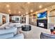 Open-concept living space with a fireplace and seamless transition to the adjacent kitchen and dining areas at 9103 Alta Dr # 1502, Las Vegas, NV 89145