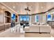 Elegant living room featuring a fireplace, custom built-ins, and breathtaking views from the balcony access at 9103 Alta Dr # 1502, Las Vegas, NV 89145
