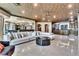 Spacious living area with comfortable sofa, sleek center table, and a design that integrates seamlessly with the kitchen at 9103 Alta Dr # 1502, Las Vegas, NV 89145