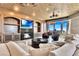 Stylish living room with a sleek fireplace, custom cabinetry, and comfortable seating arrangements at 9103 Alta Dr # 1502, Las Vegas, NV 89145