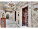 Elegant lobby area featuring ornate chandeliers, marble flooring, and elevator access at 9103 Alta Dr # 1502, Las Vegas, NV 89145