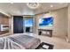 A spacious main bedroom features unique walls, a decorative fireplace, TV, and balcony access at 9103 Alta Dr # 1502, Las Vegas, NV 89145