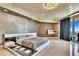 A spacious main bedroom features unique walls, a decorative fireplace, chandelier, and balcony access at 9103 Alta Dr # 1502, Las Vegas, NV 89145