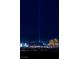 Night view showcases the city skyline's iconic pyramid illuminated with a beacon of light at 9103 Alta Dr # 1502, Las Vegas, NV 89145