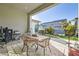 Inviting backyard with covered patio, outdoor kitchen, and mature landscaping at 9765 Skye Star Ave, Las Vegas, NV 89166