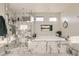 This spa-like bathroom features a soaking tub and glass enclosed shower at 9765 Skye Star Ave, Las Vegas, NV 89166