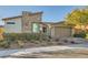 Charming single-story home featuring stone accents, desert landscaping, and an attached two-car garage at 9765 Skye Star Ave, Las Vegas, NV 89166