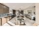 This open-concept kitchen is complete with modern appliances, a large island and tile flooring at 9765 Skye Star Ave, Las Vegas, NV 89166