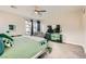 This main bedroom features natural lighting and a green color palette at 9765 Skye Star Ave, Las Vegas, NV 89166