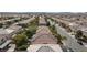 Expansive aerial of neighborhood homes with desert landscaping and mountains in distance at 10608 Medicine Bow St, Las Vegas, NV 89183