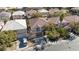 Aerial view of neighborhood homes with tile roofs and desert landscaping at 10608 Medicine Bow St, Las Vegas, NV 89183