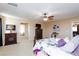 Spacious bedroom featuring a ceiling fan, fireplace, and plush carpeting at 10608 Medicine Bow St, Las Vegas, NV 89183