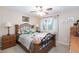 Inviting bedroom features a large window and decorative pillows on a comfortable bed at 10608 Medicine Bow St, Las Vegas, NV 89183