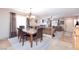 Dining room with views into the living room, fireplace, and entry to the home at 10608 Medicine Bow St, Las Vegas, NV 89183