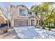 Lovely two-story home with a welcoming entrance and attached two-car garage at 10608 Medicine Bow St, Las Vegas, NV 89183