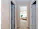 Hallway view with doorways leading to closet and bathroom with soaking tub at 10608 Medicine Bow St, Las Vegas, NV 89183
