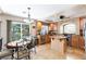 Bright kitchen features stainless steel appliances, granite countertops, and breakfast nook at 10608 Medicine Bow St, Las Vegas, NV 89183