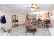 Comfortable living room area with plush seating, and an open view to the dining and kitchen areas at 10608 Medicine Bow St, Las Vegas, NV 89183