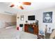 Cozy living room featuring a fireplace, TV, and entertainment center, perfect for relaxation at 10608 Medicine Bow St, Las Vegas, NV 89183