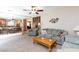 Open living room featuring comfortable seating and a view to the kitchen, bar, and dining room at 10608 Medicine Bow St, Las Vegas, NV 89183