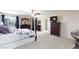 Spacious main bedroom with a TV, dark wood furniture, and relaxing decor at 10608 Medicine Bow St, Las Vegas, NV 89183