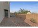 Private patio area featuring brick pavers, a brick fence, and two Adirondack chairs at 169 Volti Subito Way, Henderson, NV 89011