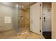 Bathroom with a marble shower featuring glass door and a tiled alcove at 2000 Fashion Show Dr # 2403, Las Vegas, NV 89109