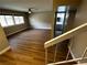 Bright living room with wood floors and a view of the stairs and bathroom at 2506 Paradise Village Way, Las Vegas, NV 89120