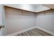 Spacious closet with wooden rod and neutral paint for organizing and storing clothes at 2705 Brill St, Las Vegas, NV 89108