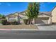 Charming single-story home featuring a well-maintained front yard with desert landscaping and a two-car garage at 2705 Brill St, Las Vegas, NV 89108