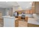 A spacious kitchen with wood cabinets and stainless steel appliances at 2705 Brill St, Las Vegas, NV 89108