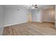 Spacious living room featuring wood-look floors and a ceiling fan for added comfort at 2705 Brill St, Las Vegas, NV 89108