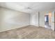 A neutral carpeted bedroom features a closet and an additional room off of it at 3337 Irv Marcus Dr, Las Vegas, NV 89108