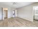 A neutral carpeted bedroom features a closet, a bathroom, and an additional room off of it at 3337 Irv Marcus Dr, Las Vegas, NV 89108