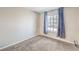 This carpeted bedroom features a window dressed with star pattern curtains at 3337 Irv Marcus Dr, Las Vegas, NV 89108