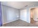 This bedroom features carpet flooring, a double door closet, and light gray paint at 3337 Irv Marcus Dr, Las Vegas, NV 89108