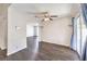 Dining area with wood-look floors, ceiling fan and access to the backyard through sliding glass doors at 3337 Irv Marcus Dr, Las Vegas, NV 89108