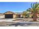 Charming one-story home with a two-car garage, solar panels, and beautiful desert landscaping at 3337 Irv Marcus Dr, Las Vegas, NV 89108