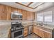 Well-equipped kitchen with granite countertops and stainless steel appliances at 3337 Irv Marcus Dr, Las Vegas, NV 89108